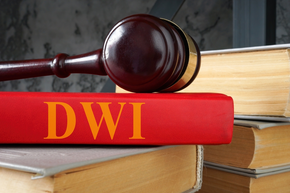 A book titled "Driving While Intoxicated (DWI) Law" positioned on a shelf, representing legal resources related to DWI cases.






