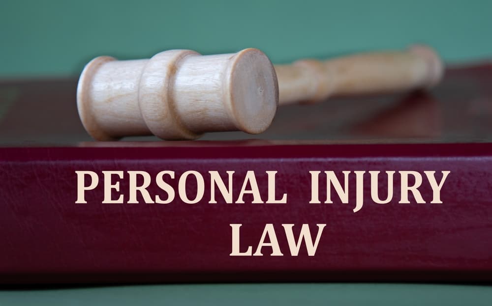 PERSONAL INJURY LAW BOOK WITH GAVEL