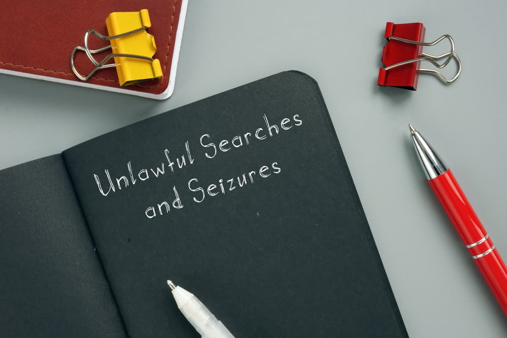 Unlawful Searches and Seizures sign on the page