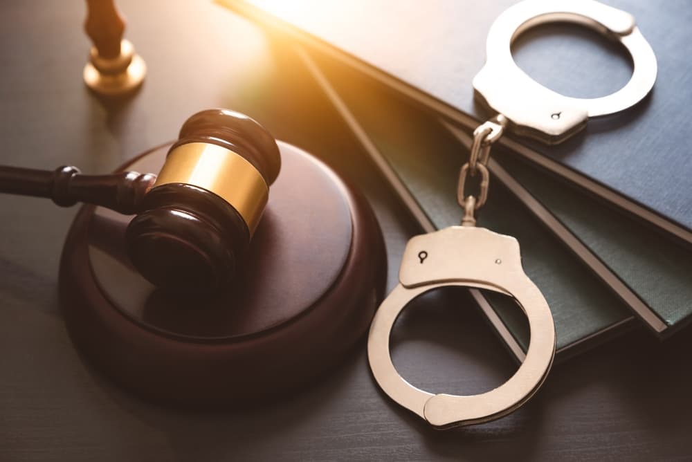 Handcuffs and wooden gavel, Marijuana criminal defense